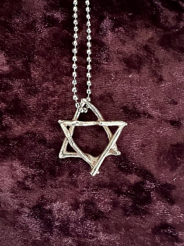 103246213-15219599-A_picture_of_the_2cm_Star_of_David_necklace_at_the_center_of_the-a-13_1761214255255.jpg