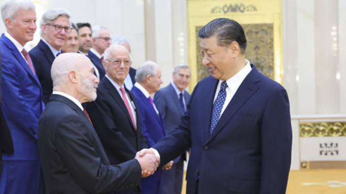 evan-greenberg-shaking-hands-with-xi.png