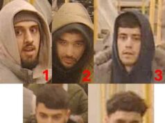 Procure por cinco homens envolvidos no assalto ao metrô de Londres depois que uma gangue esfaqueou um passageiro no rosto e roubou sua bolsa quando ele tentou impedi-los de ameaçar um passageiro idoso