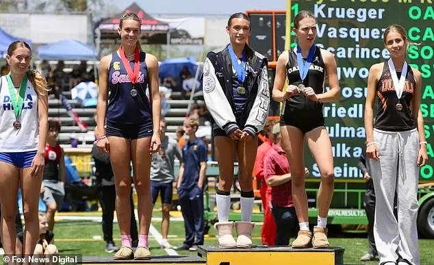 108671873-15829505-AB_Hernandez_shared_the_top_step_of_the_podium_with_co_champions-a-4_1779189782365.jpg