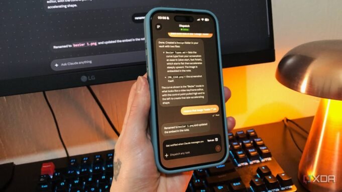 claude-dispatch-on-desktop-and-phone-lamp-and-keyboard-in-view.jpeg