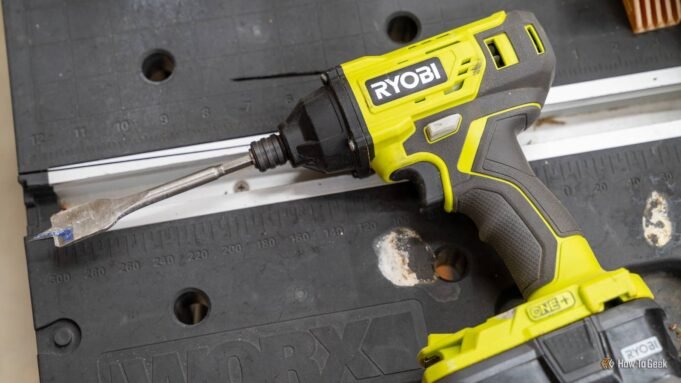 close-up-of-a-ryobi-one-plus-18v-impact-driver-with-a-spade-bit-attached.jpg